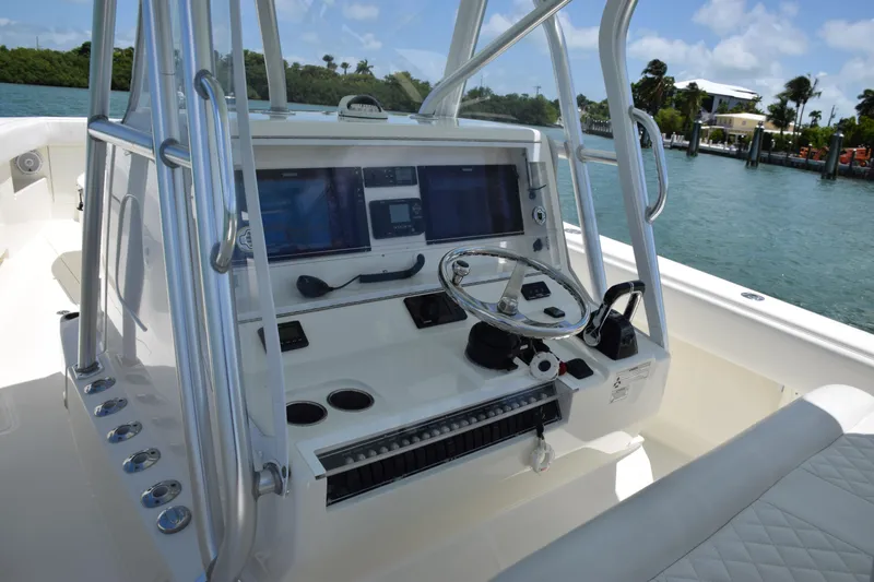  Yacht Photos Pics 2015 SeaVee 370z boat console with dual screens and steering wheel.