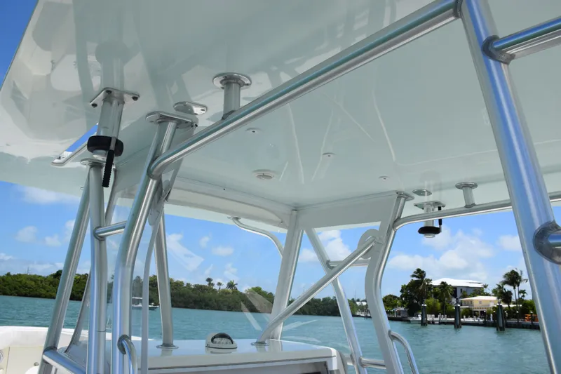  Yacht Photos Pics 2015 SeaVee 370z boat with T-top and rod holders on a sunny day.