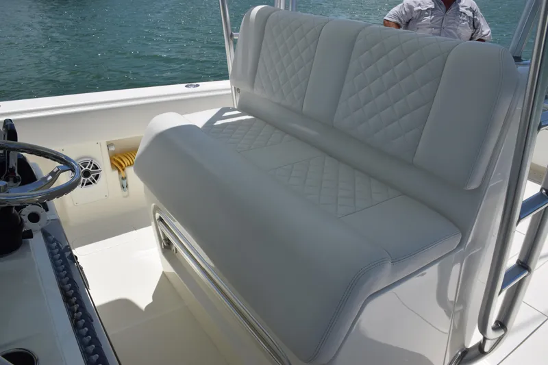  Yacht Photos Pics 2015 SeaVee 370z boat with white cushioned seating and steering wheel.