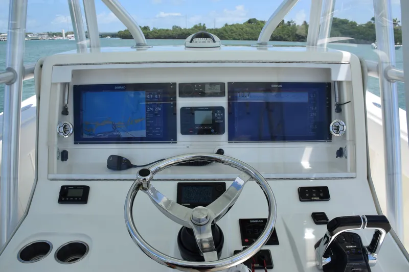  Yacht Photos Pics 2015 SeaVee 370z boat dashboard with navigation screens and steering wheel.