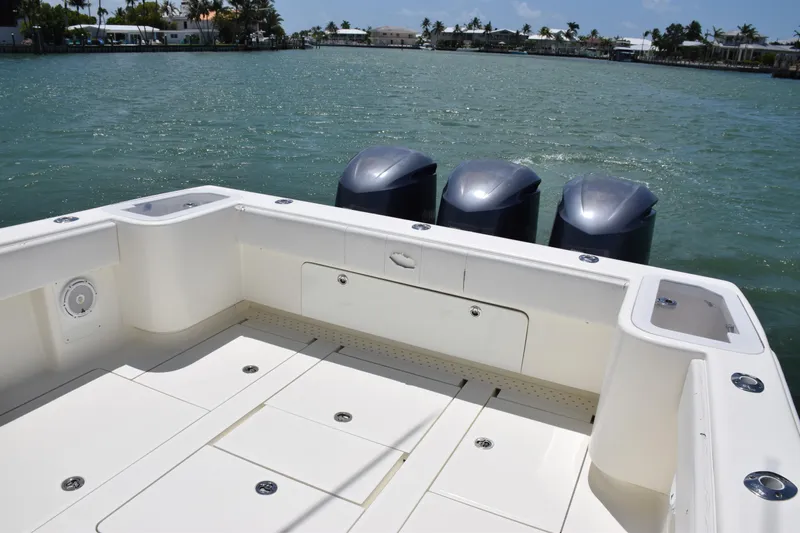  Yacht Photos Pics 2015 SeaVee 370z boat with triple outboard engines on calm water.