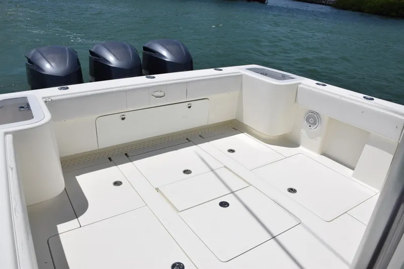  Yacht Photos Pics SeaVee 370z 2015 boat deck with triple outboard motors on water.
