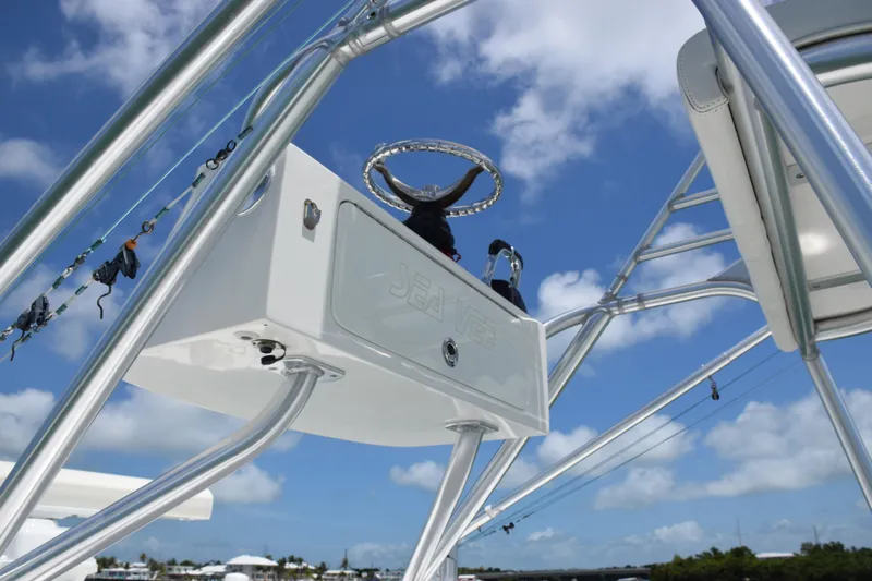  Yacht Photos Pics 2015 SeaVee 370z boat helm station with blue sky background.