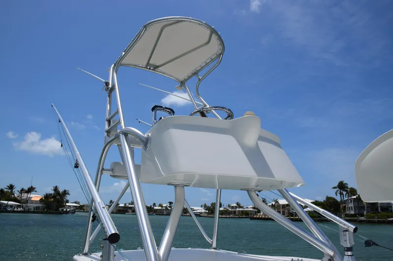  Yacht Photos Pics 2015 SeaVee 370z boat tower with controls and canopy on a sunny day.