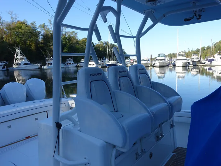  Yacht Photos Pics 2016 Regulator 41 boat interior with seating, docked in a marina.