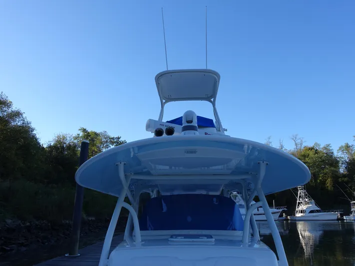  Yacht Photos Pics 2016 Regulator 41 boat docked, featuring a sleek design and clear blue sky backdrop.