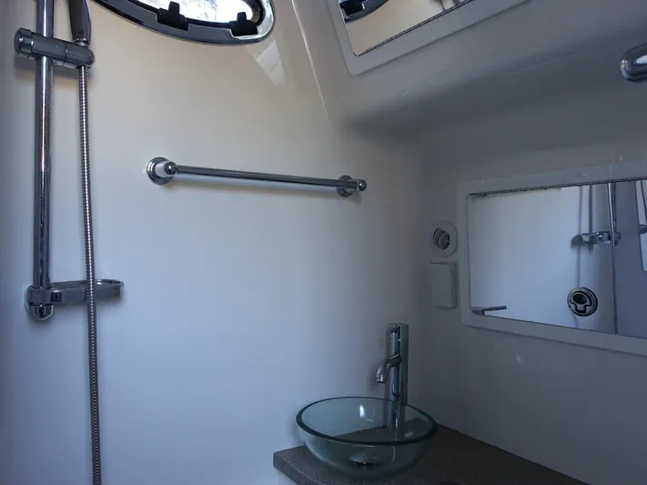  Yacht Photos Pics 2016 Regulator 41 boat bathroom with modern sink and shower.