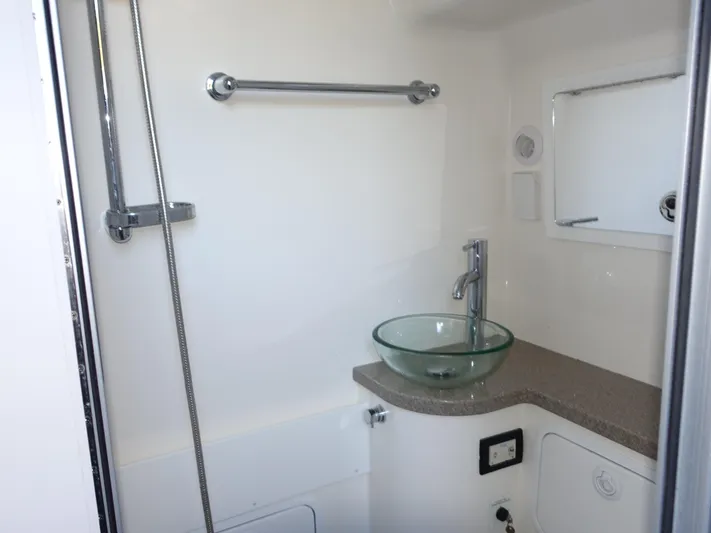  Yacht Photos Pics Modern bathroom in 2016 Regulator 41 boat with glass sink and shower.