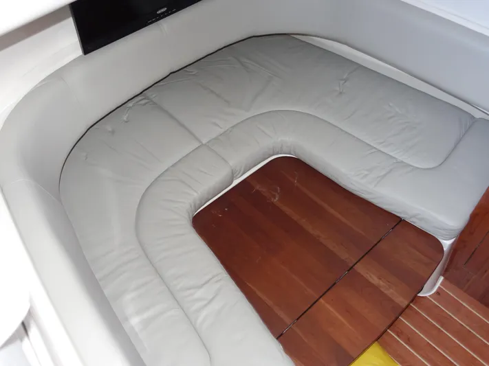  Yacht Photos Pics 2016 Regulator 41 boat interior with cushioned seating and wooden flooring.