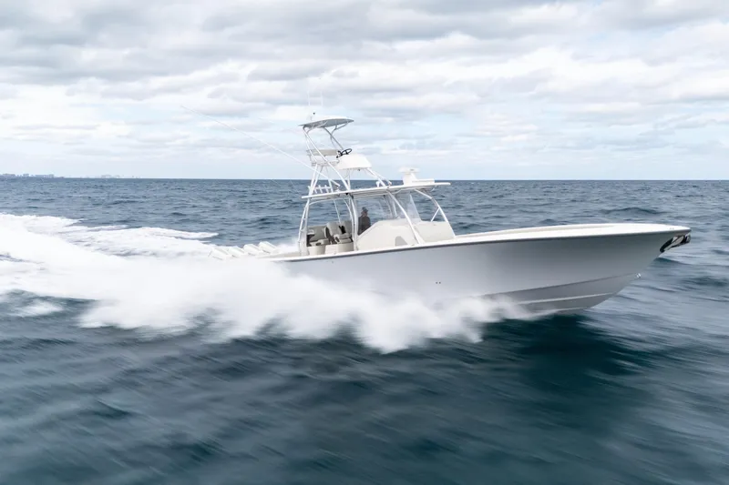  Yacht Photos Pics 2026 SeaVee 420Z boat speeding on open ocean under cloudy sky.