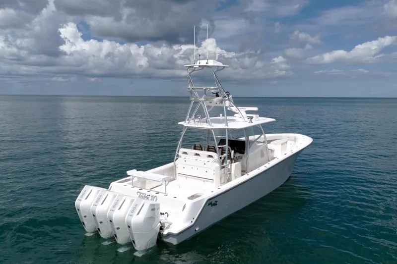  Yacht Photos Pics 2026 SeaVee 420Z boat with four engines on calm ocean waters.