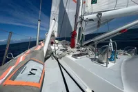 Sailing on Devonport Challenge 67 yacht, 1992 model, with sails unfurled on open sea.
