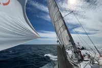 Sailing on Devonport Challenge 67 yacht, 1992 model, under clear blue skies.