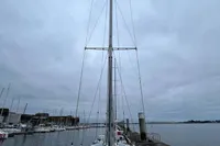 Sailboat Devonport Challenge 67, 1992 model, docked at a marina under cloudy skies.