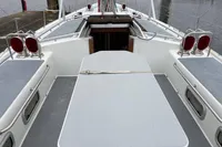 Deck view of 1992 Devonport Challenge 67 yacht, featuring seating and hatch access.