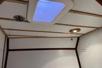 Interior ceiling of 1992 Devonport Challenge 67 yacht with skylight and lighting.