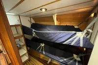 Interior of 1992 Devonport Challenge 67 yacht with bunk beds and wooden paneling.