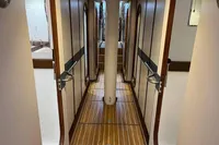 Devonport Challenge 67 yacht interior corridor, 1992 model, featuring wooden flooring and elegant design.