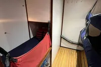 Interior of 1992 Devonport Challenge 67 yacht with wooden flooring and bunk beds.