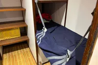 Bunk bed with blue straps in 1992 Devonport Challenge 67 yacht interior.