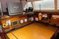 Navigation station of 1992 Devonport Challenge 67 yacht with Raymarine equipment and communication devices.