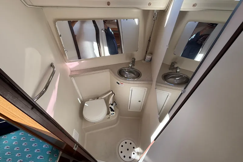 Sandman Yacht Photos Pics Bathroom interior of 2004 Catalina 400 MkII yacht with sink and toilet.