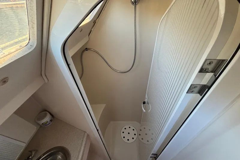 Sandman Yacht Photos Pics Shower area in 2004 Catalina 400 MkII sailboat with compact design and modern fixtures.