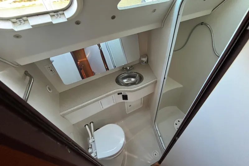 Sandman Yacht Photos Pics 2004 Catalina 400 MkII yacht bathroom with sink, toilet, and shower.
