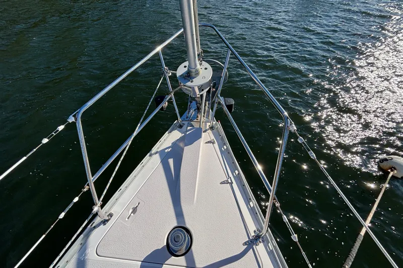 Sandman Yacht Photos Pics Bow of 2004 Catalina 400 MkII sailboat on sparkling water.