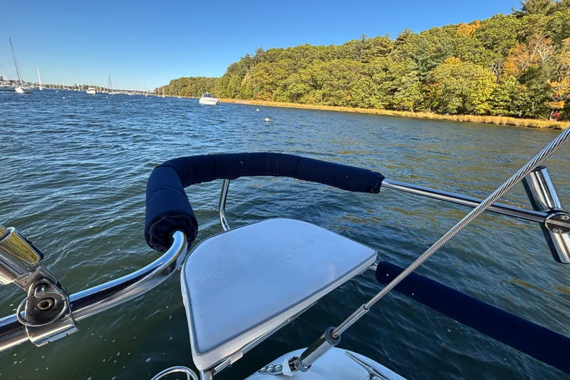 Sandman Yacht Photos Pics Catalina 400 MkII sailboat on water near forested shoreline, 2004 model.