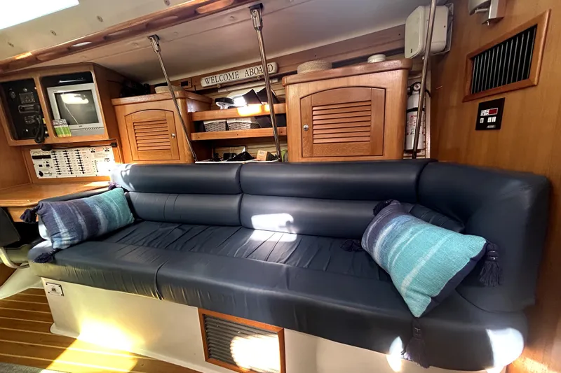 Sandman Yacht Photos Pics Interior of 2004 Catalina 400 MkII yacht with blue leather seating and nautical decor.