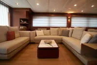 Luxurious interior of 2010 Custom Line Navetta 33 yacht with plush seating and elegant decor.