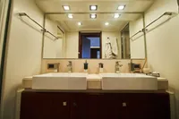 Luxurious bathroom with double sinks on Custom Line Navetta 33 yacht, 2010 model.