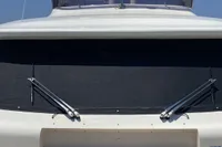 Custom Line Navetta 33 yacht, 2010 model, front view with clear blue sky.