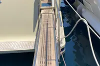Custom Line Navetta 33 yacht gangway, 2010 model, docked in a marina.
