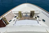 Bow view of 2010 Custom Line Navetta 33 yacht docked in a marina.