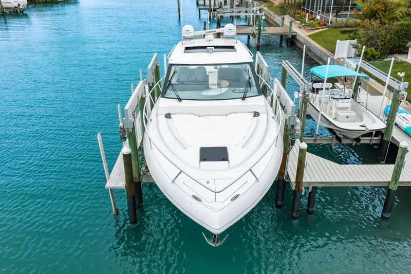  Yacht Photos Pics 2019 Intrepid 410 Evolution yacht docked in clear blue water.