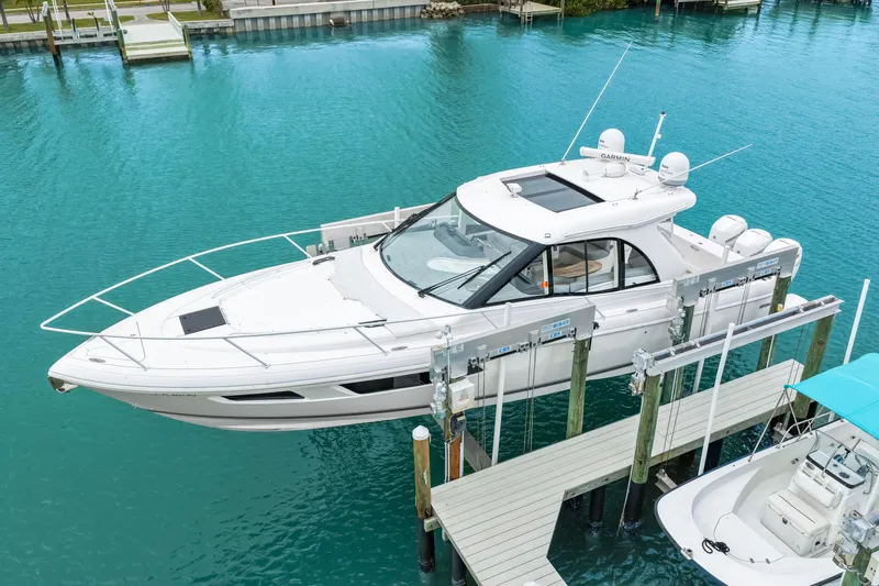  Yacht Photos Pics 2019 Intrepid 410 Evolution yacht docked in turquoise waters.