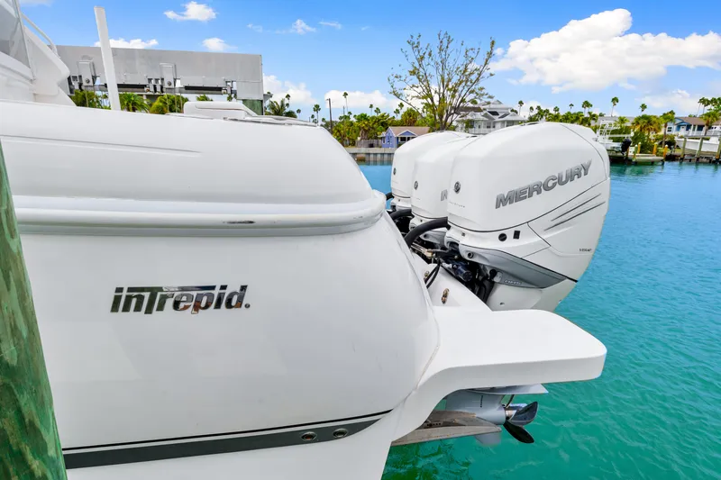 Yacht Photos Pics 2019 Intrepid 410 Evolution boat with Mercury engines docked in a tropical marina.