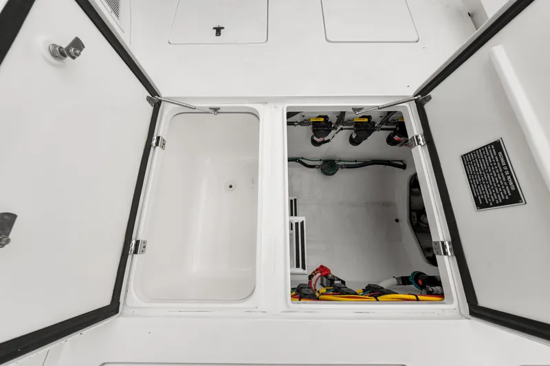  Yacht Photos Pics 2019 Intrepid 410 Evolution storage compartments with electrical components and wiring.