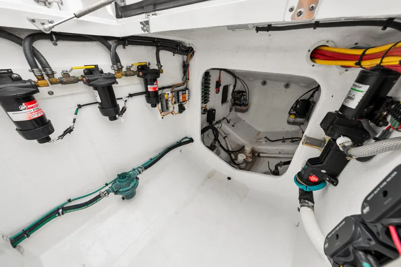  Yacht Photos Pics Engine room of 2019 Intrepid 410 Evolution boat, showcasing fuel filters and wiring.