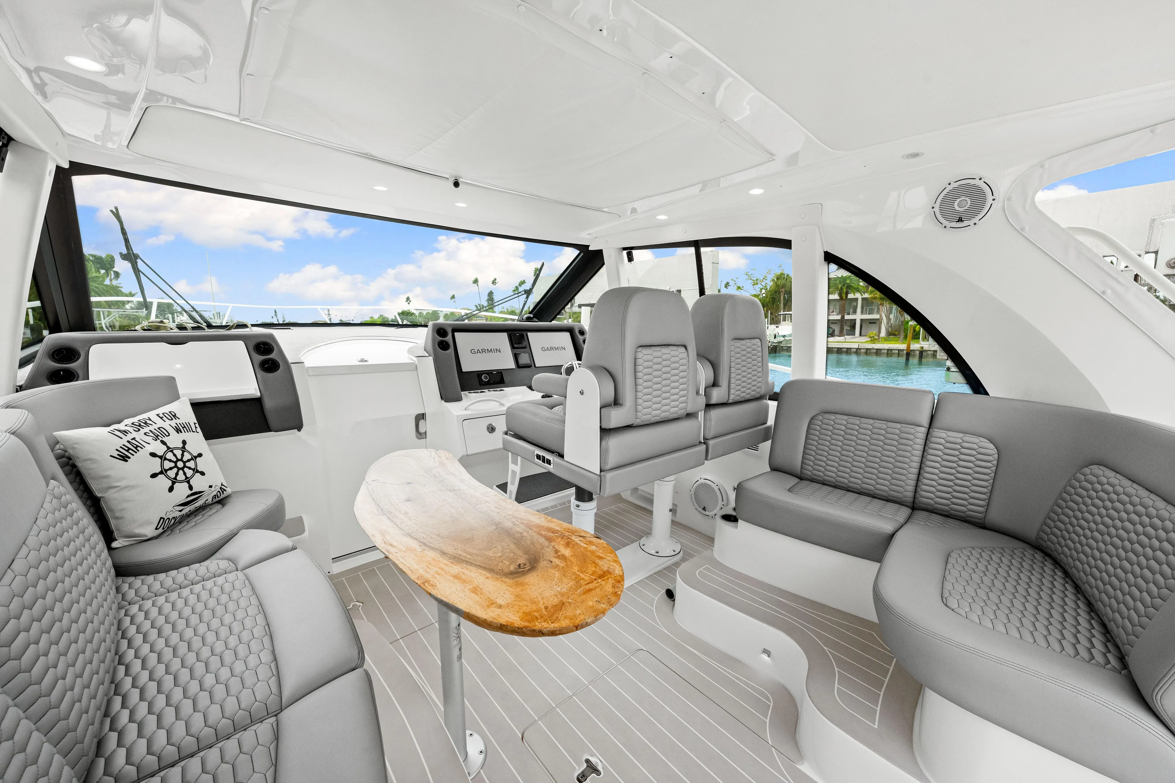  Yacht Photos Pics Luxurious interior of 2019 Intrepid 410 Evolution yacht with modern seating and navigation equipment.