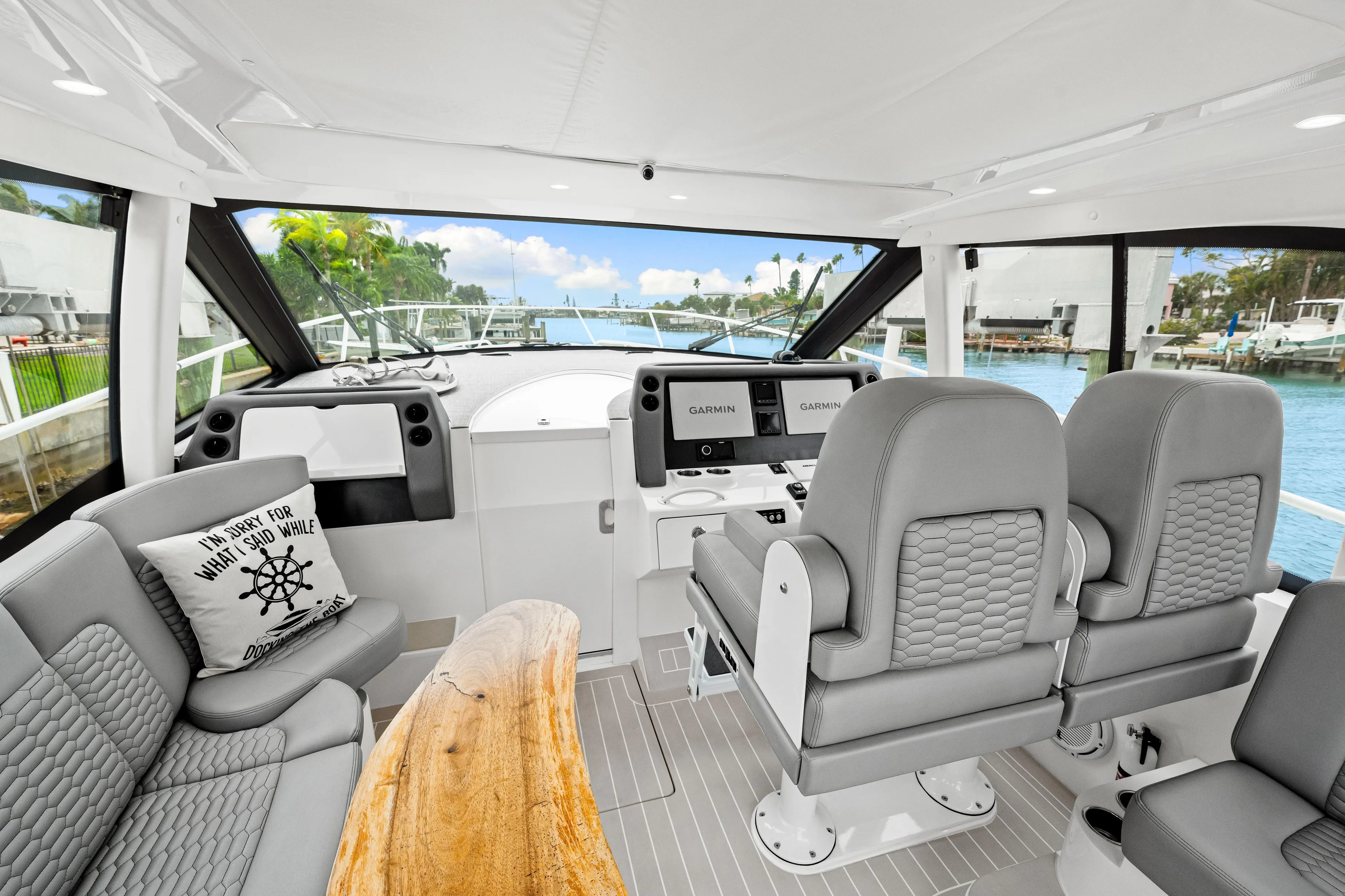  Yacht Photos Pics Interior of 2019 Intrepid 410 Evolution yacht with modern seating and navigation equipment.