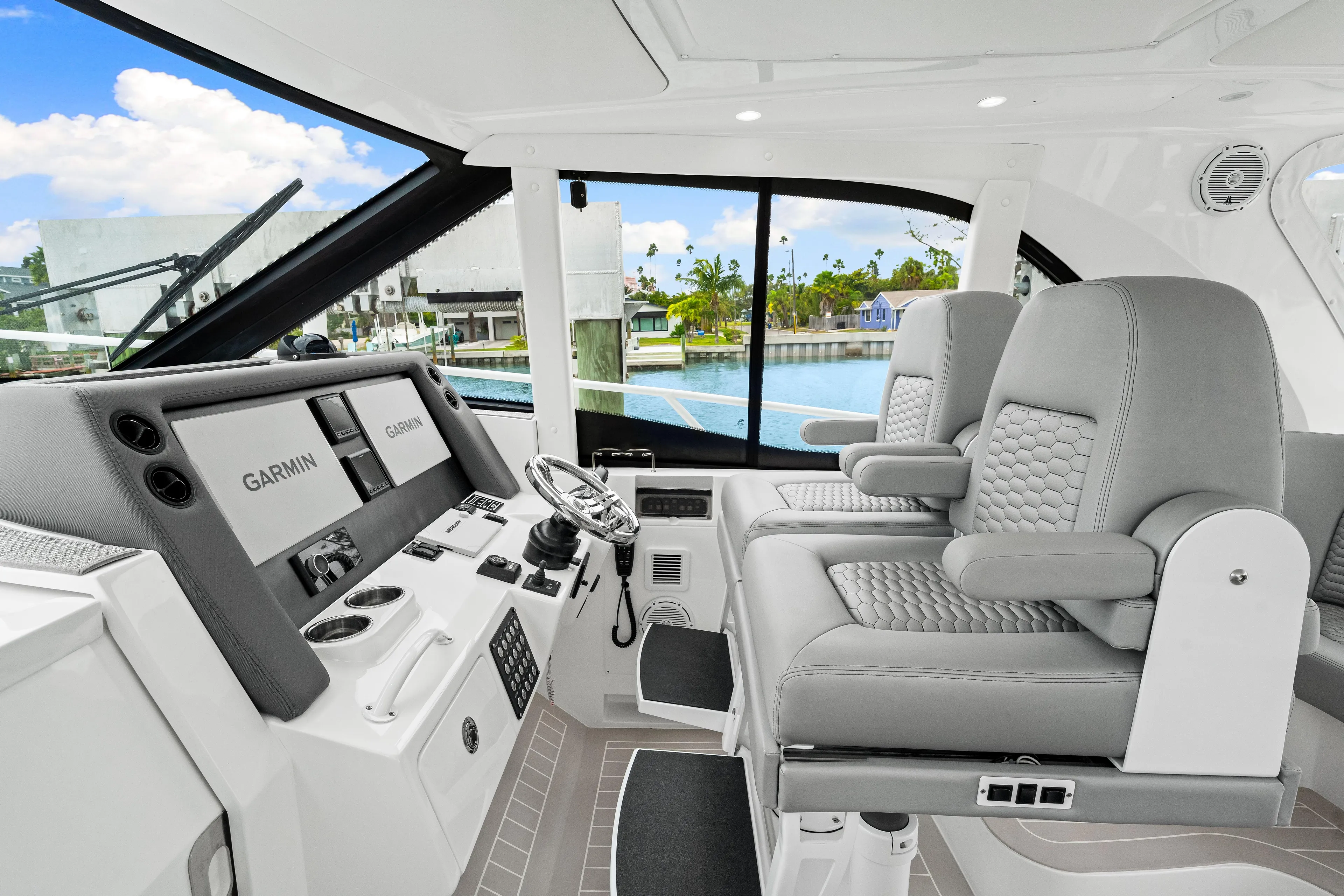  Yacht Photos Pics 2019 Intrepid 410 Evolution helm with Garmin displays and luxurious seating.