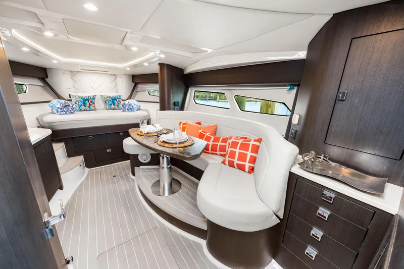  Yacht Photos Pics Luxurious interior of 2019 Intrepid 410 Evolution yacht with modern seating and decor.