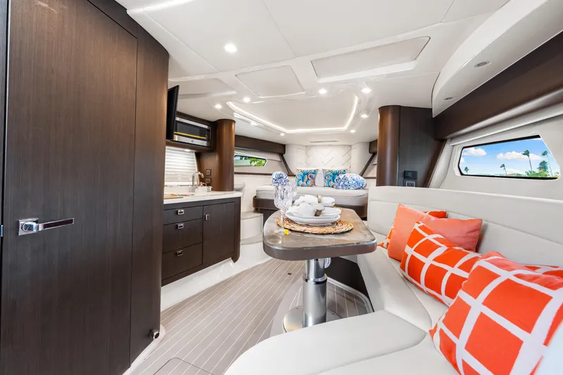  Yacht Photos Pics Luxurious interior of 2019 Intrepid 410 Evolution yacht with modern design and vibrant accents.