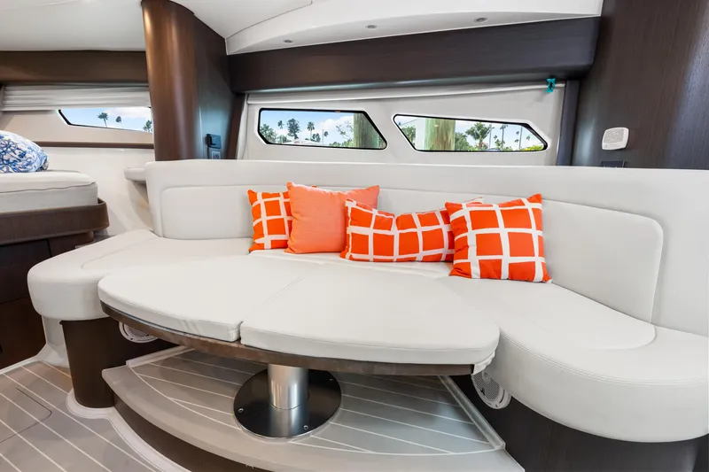  Yacht Photos Pics Luxurious interior of 2019 Intrepid 410 Evolution yacht with stylish seating and vibrant cushions.