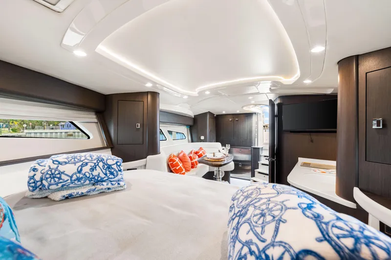  Yacht Photos Pics Luxurious interior of 2019 Intrepid 410 Evolution yacht with elegant bedding and modern amenities.