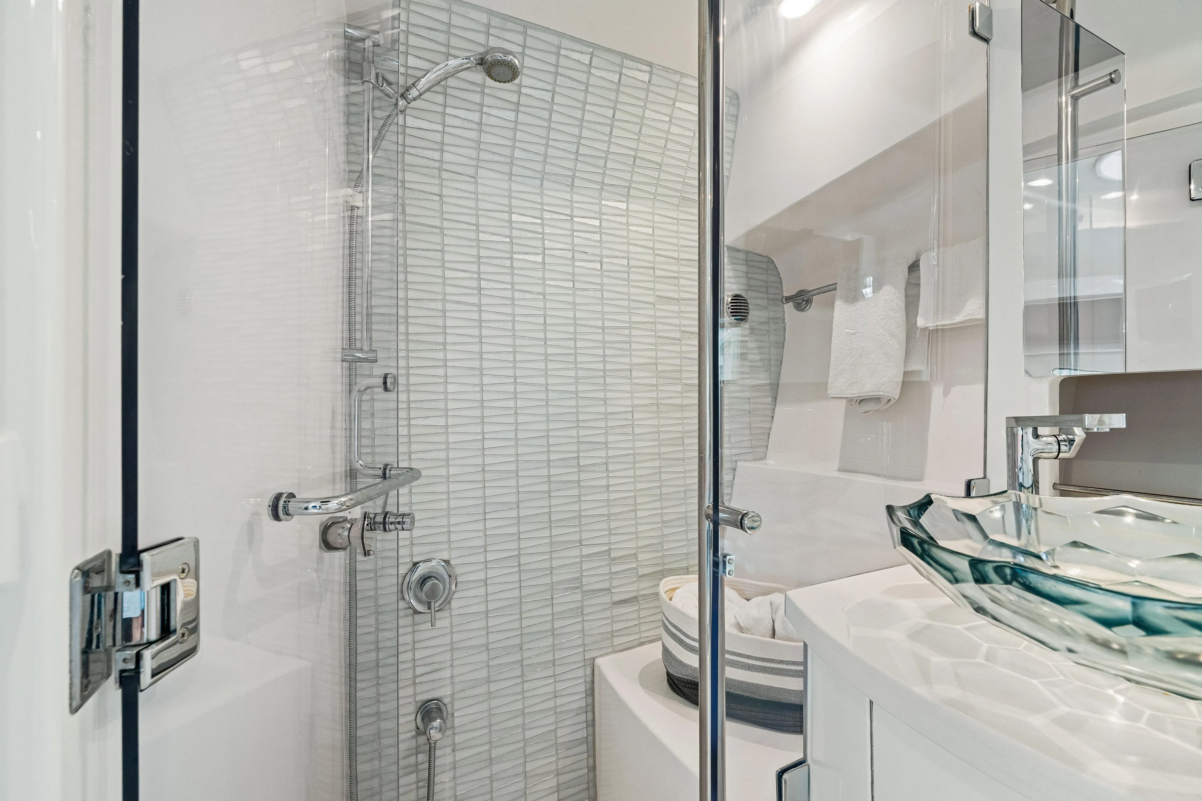  Yacht Photos Pics Luxurious bathroom in 2019 Intrepid 410 Evolution yacht with modern glass sink and shower.