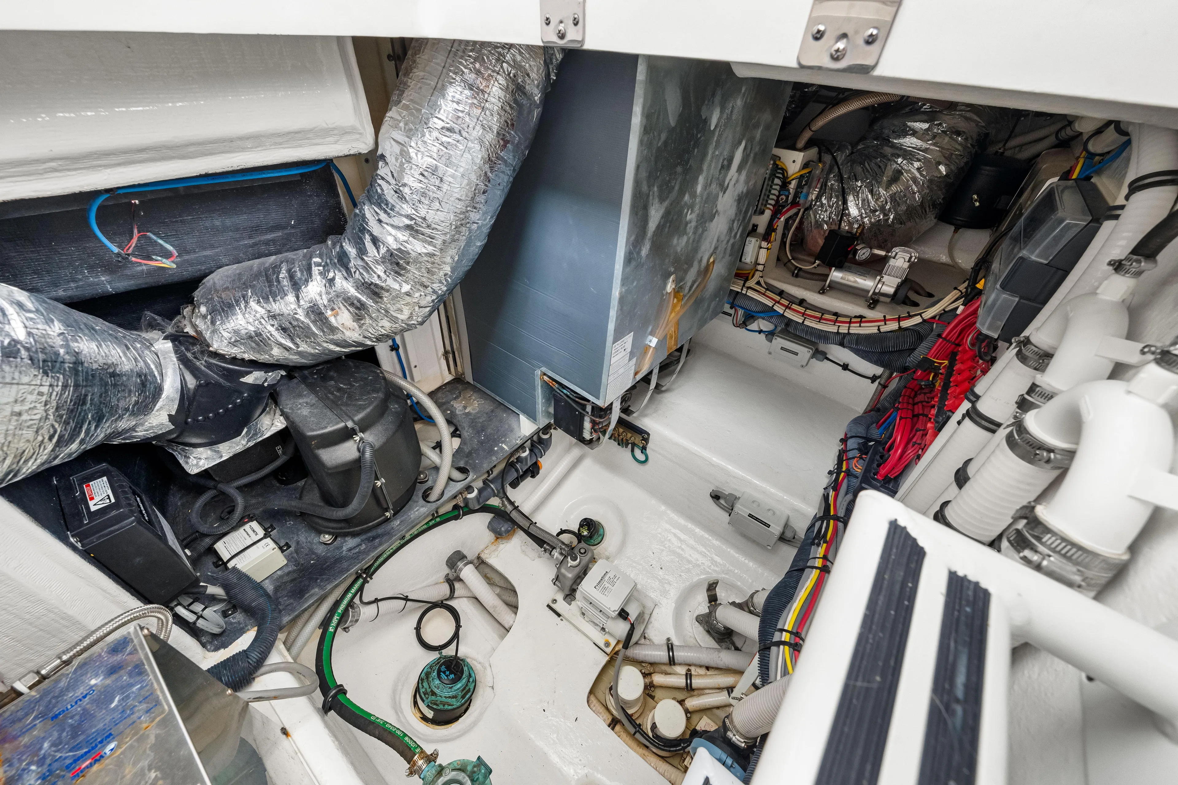  Yacht Photos Pics Engine room of 2019 Intrepid 410 Evolution boat with complex wiring and machinery.